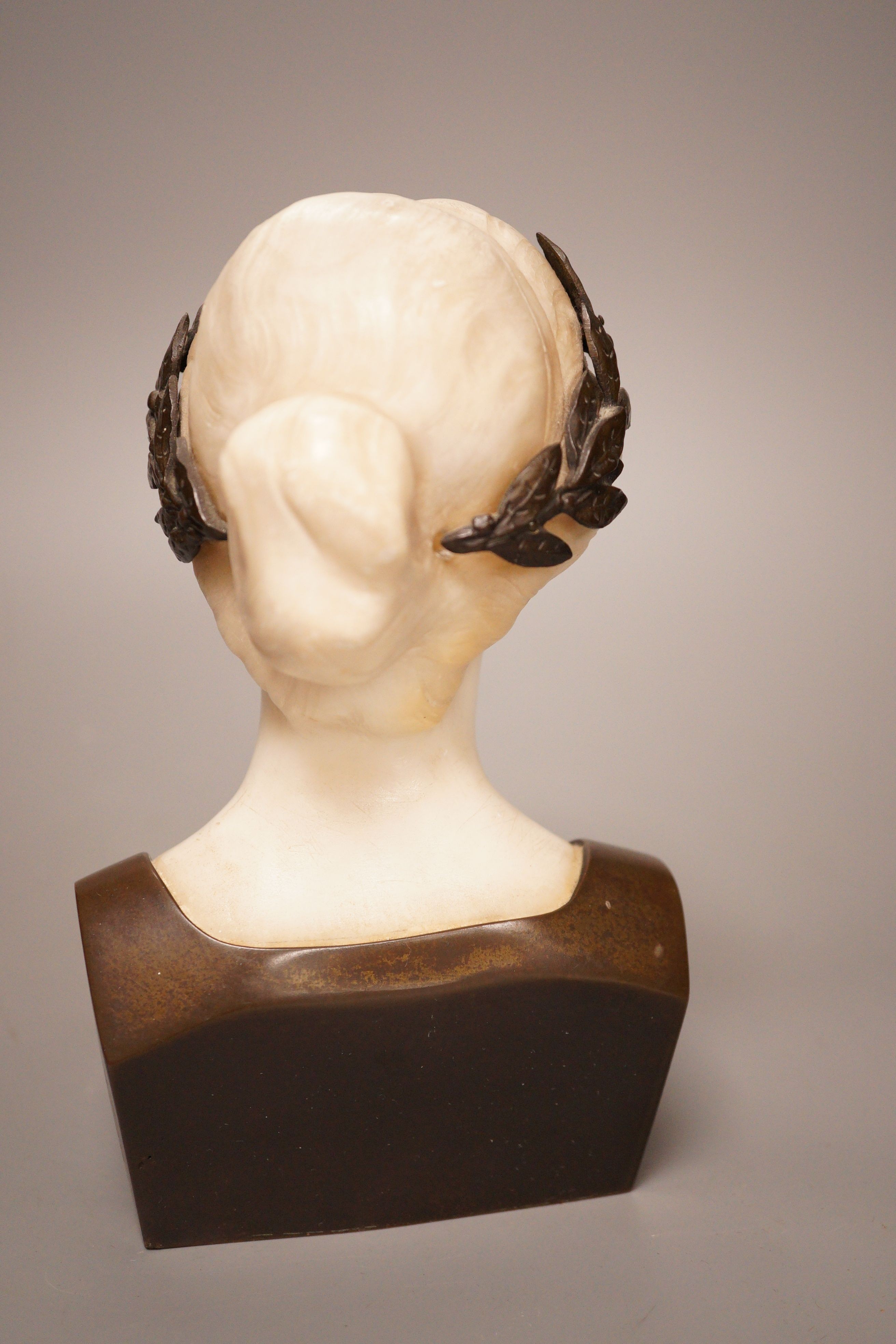 A late 19th/early 20th century French bronze and alabaster bust of a lady, 19cm